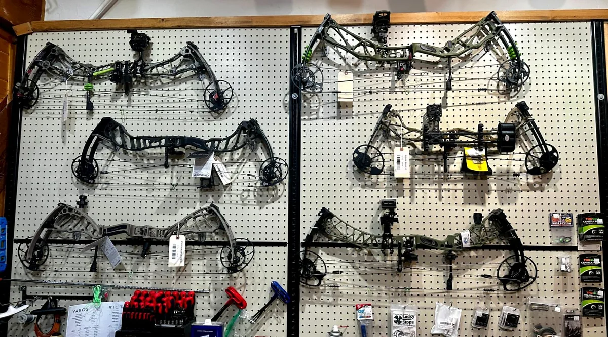 Wall of compound bows at the archery shop in Pagosa Springs